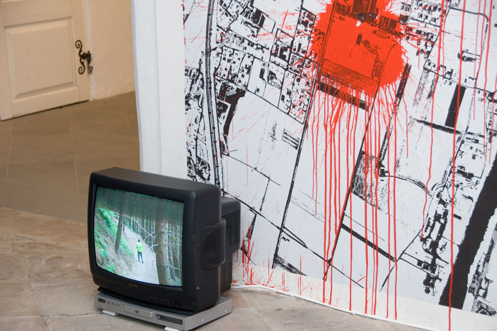 Exhibition view (Detail), Anarchy Now, 2011, Installation, scaleable, video, printed caution tape, acrylic on printed wallpaper (250 x 320 cm), Artist Jürgen Bauer