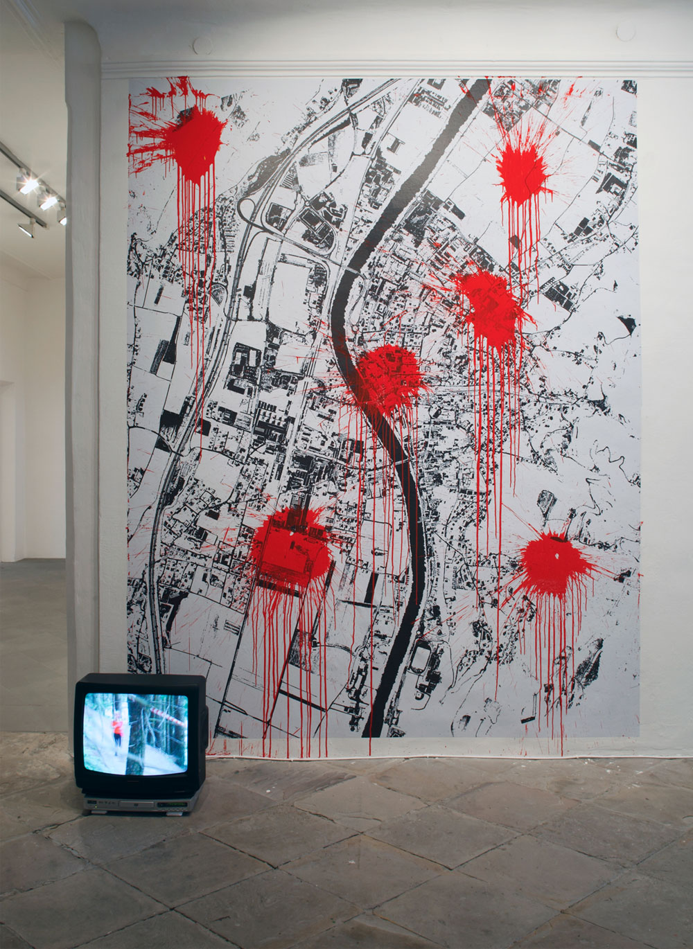 Exhibition view, Anarchy Now, 2011, Installation, scaleable, video, printed caution tape, acrylic on printed wallpaper (250 x 320 cm), Artist Jürgen Bauer