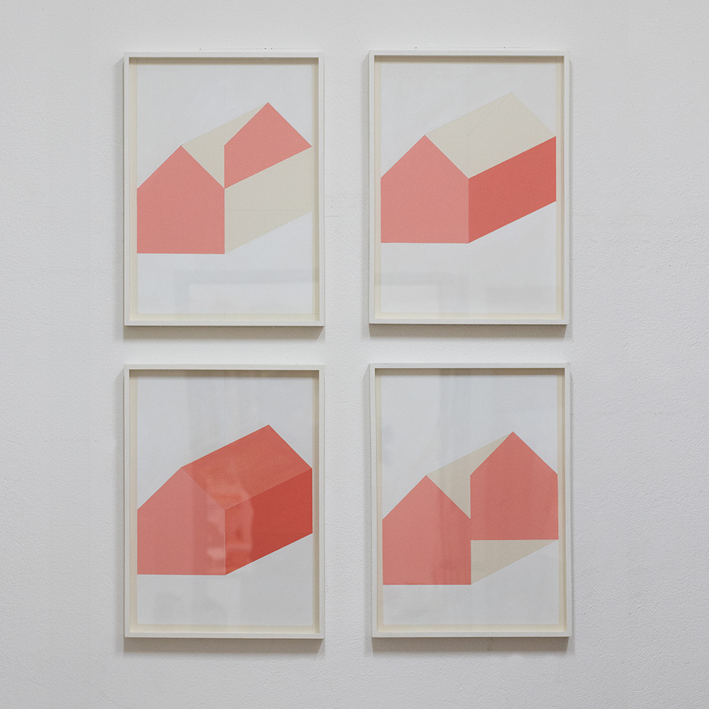 Image of four artworks from artist Jürgen Bauer on cardboard, framed on studiowall